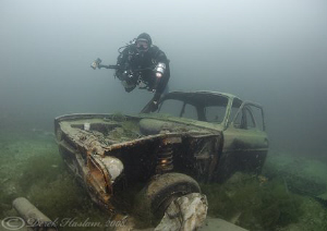 Mark with car wreck. D200, 10.5mm. by Derek Haslam 